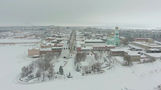 Syzran City and Frozen Volga River in Winter on Cloudy Day. Russia. Aerial View.