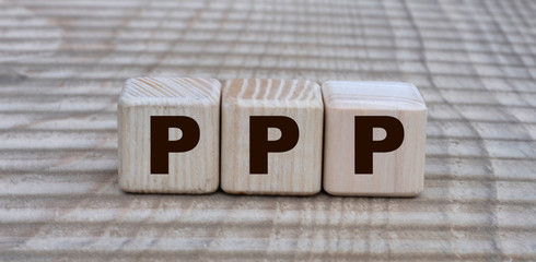 concept of the word PPP on cubes on a beautiful background