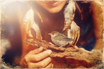 woman with a small bird. bird in hand, old photo effect.