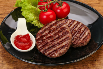 Grilled burger cutlet with sauce