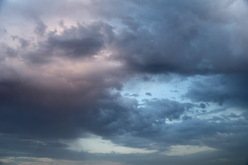 Fototapeta na wymiar Dark cloudy sunset skies, full frame background
