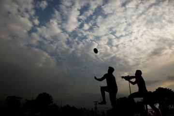 Silhouette of a man with a rugby ball - Powered by Adobe