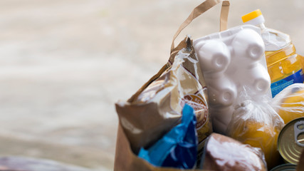 Food donation basket for people. The concept of quarantine assistance during the coronavirus pandemic. Food delivery. Volunteer assistance. Close-up.