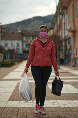 Young Woman wear mask for shopping during Covid-19 Pandemic  in Bulgaria 