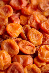 Dried apricots background. Heap of dry apricot fruits