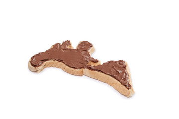 Toast bread in the form of the american continent with chocolate spread isolated on a white background