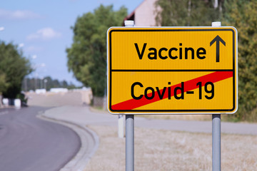 Yellow sign points away from Covid-19