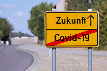 Yellow sign points away from Covid-19