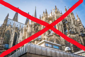 Cologne Cathedral on the west side and Roncalli Square in Cologne, Germany. The house is a Roman Catholic Gothic cathedral. Barrier tape, red line - quarantine, isolation, entry ban. Do not cross. Pan