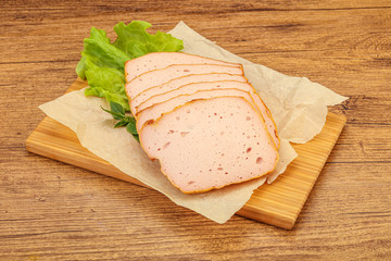 Boiled pork sausage over board