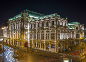 Fototapeta na wymiar Night image of the Vienna Opera House with blurred traffic lights