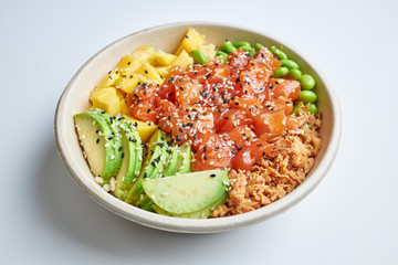 Poke salad with salmon, avocado, mango, edamame, crispy onion and sesame seeds.