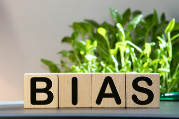 Bias - word from wooden blocks with letters, personal opinions prejudice bias concept, random...