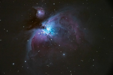 Beautiful nebulas in the constellation Orion called Orion nebula and Running Man nebula. High ISO long time exposure taken with photo camera and long focus telescope on tracking mount