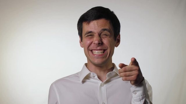 Funny man taunts, on a gray background