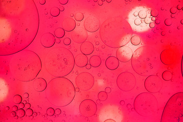 Closeup beautiful liquid bubble on surface colorful background