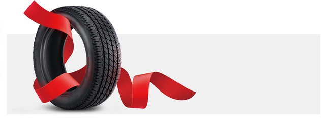 tire on a gray background with a red ribbon