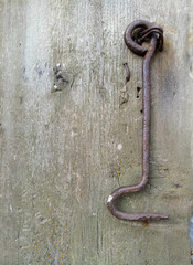 Obraz premium texture of old painted shabby rustic wooden fence made of planks, with rusty nails, hand-forged iron elements, grunge background