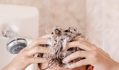hands of a man washing face