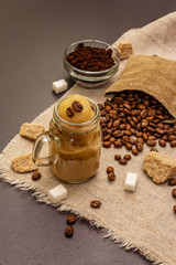 Dalgona coffee in mason jar. Korean fluffy whipped coffee beverage