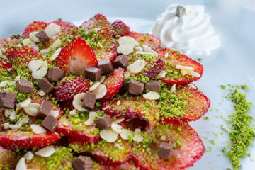 Strawberry tart. Summer dessert with strawberries, pistachio and vanilla cream. Summer dessert with strawberries, pistachio and vanilla cream.