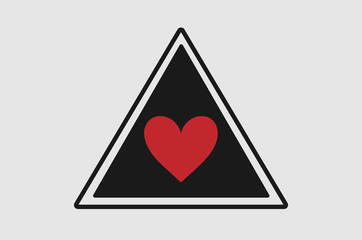 Triangular road warning sign with heart symbol on black background