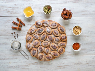 Eid Dates sweets on a wooden table, top view.