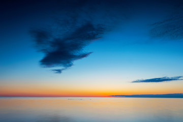 Vibrant ocean sunset, long exposure