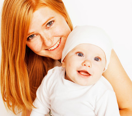 young beauty mother with cute baby, red head happy modern family smiling isolated on white background close up, lifestyle people concept