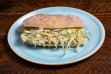 Sandwich with chicken meat.