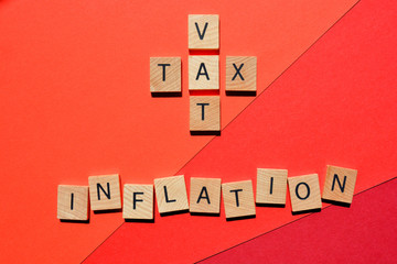 VAT and Tax in crossword form with the word Inflation on red background