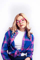 Naklejka premium young pretty blond teenage hipster girl in glasses posing emotional happy smiling, gesturing isolated on white background, lifestyle poeple concept