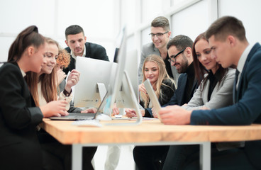 group of young employees working in the office