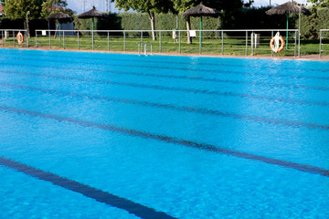 Fototapeta na wymiar Olympic pool with a blue water