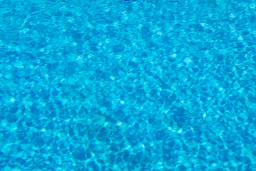 Blue and crystalline water of a swimming pool