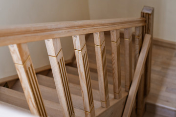 Detail of the wooden interior staircase in the house. Selective focus. Low DOF