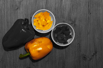 Yellow color isolation effect of whole and chopped peppers. Concept: food and vegetables