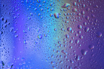 Violet-blue gradient with drops on glass. Background with water drops. Blue background with water drops.