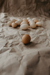 Many dirty eggs on craft paper background