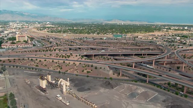 Aerial: Traffic on a busy freeway interchange of Interstate 25 & Interstate 40. Albuquerque, New Mexico, USA