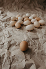 Many dirty eggs on craft paper background