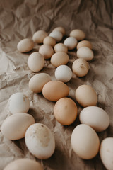 Many dirty eggs on craft paper background