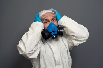 funny epidemic specialist guy disinfectant control public places disinfecting cleaning arms crossed wear hazmat protective suit goggles mask isolated grey color background