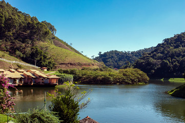 Obraz premium Large dark water lake, with houses and lots of forest around, Barra do Pirai, Rio de Janeiro, Brazil