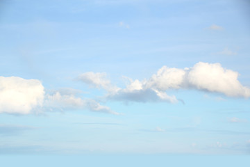 beautiful fluffy clouds in the blue sky, natural landscape, the concept of the divine beauty of nature, blurred background for the designer