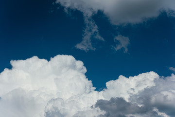 Naklejka na ściany i meble large white сumulus clouds in a bright blue sky