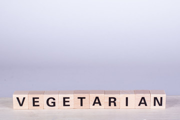 wooden cubes building the word Vegetarian, white background