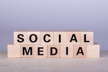 wooden cubes building the word Social Media, white background