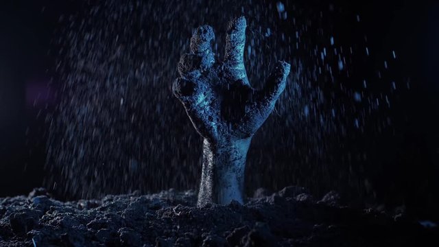 Zombie hand rising out from the ground