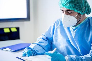 Epidemic. Doctor in protective suit in doctor's office.